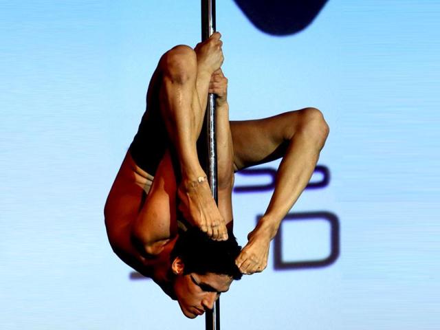 Renzo Escudero Zerga of Peru performs in the men's category at the Miss Pole Dance South America competition in Buenos Aires. (Reuters Photo)