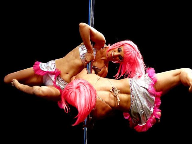 Pole dance couple Polet Cuevas and Munira Hasen of Chile perform in the doubles' category of the Miss Pole Dance South America 2013 competition in Buenos Aires. (AP Photo)