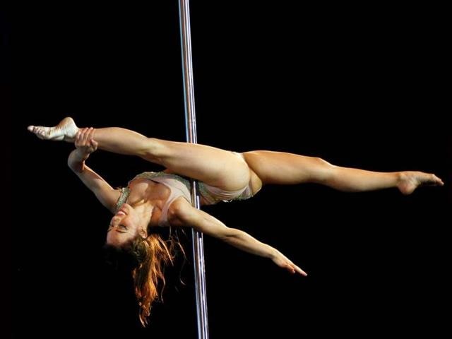 Pole dancer Maria Aguiar, of Argentina, performs in the Miss Pole Dance South America 2013 and Pole Dance Argentina 2013 competitions in Buenos Aires, Argentina (AP Photo)