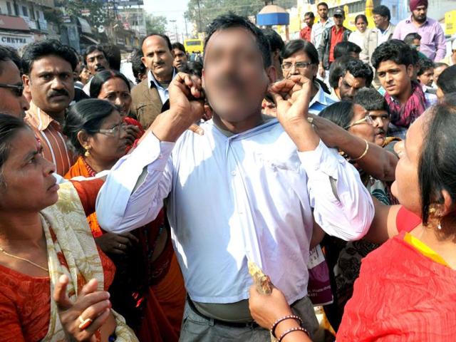 Nari-Sena-members-punishing-a-man-at-Albert-Ekka-chowk-in-Ranchi-HT-Photo