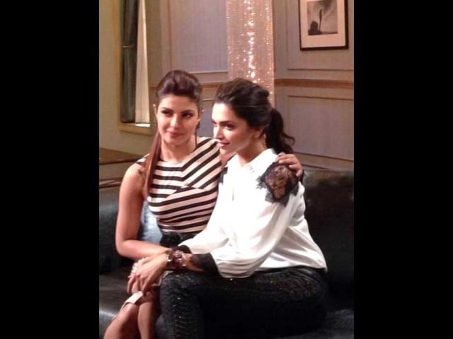 Priyanka Chopra, Deepika Padukone get cosy on the sets of Koffee with Karan 4.