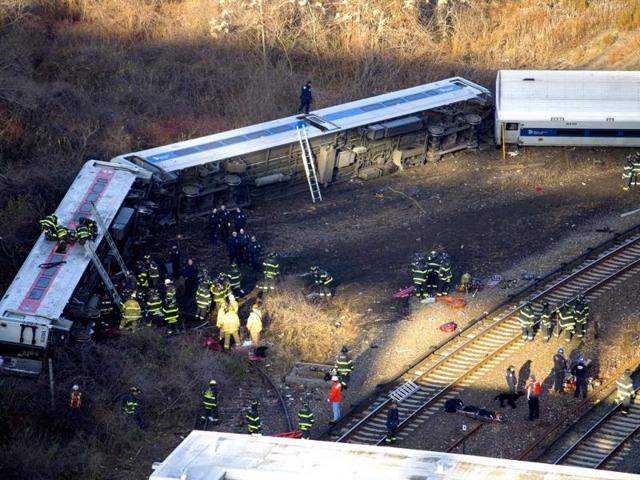 First responders gather at the derailment of a Metro North passenger train in the Bronx borough of New York. (AP Photo)