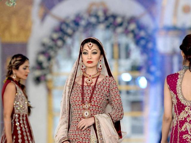 A Pakistani model presents a creation by designer Aisha Imran on the last day of the Pantene Bridal Couture Week 2013 in Lahore on late December 1, 2013. (AFP Photo)