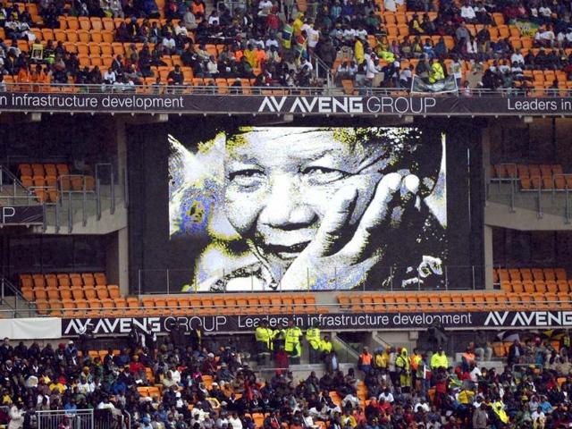 A screen shows South African former president Nelson Mandela during his memorial service at the FNB Stadium (Soccer City) in Johannesburg. (AFP Photo)