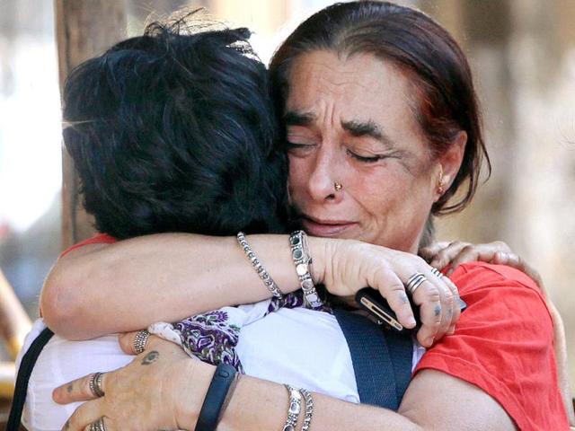 Activists of LGBT community react after Supreme Court's verdict on homosexuality, in Mumbai. (PTI PHOTO)