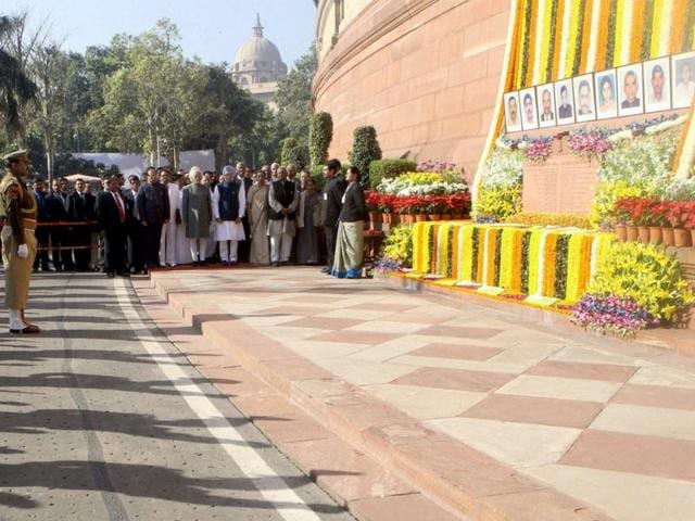CRPF personnel and Parliamentarians during the tribute paying ceremony for the martyrs of Parliament attack on its 12th anniversary, at Parliament House. (PTI Photo)