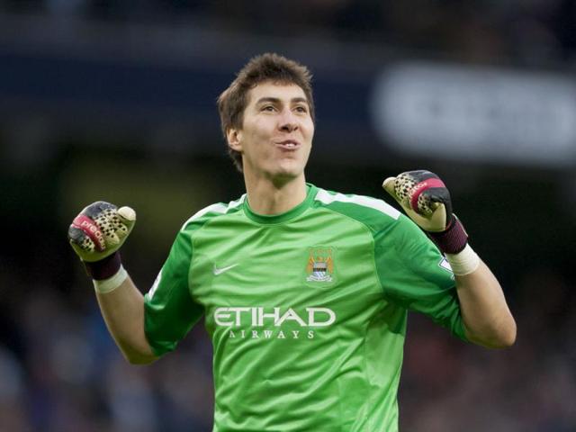 Manchester City's goalkeeper Costel Pantilimon celebrates his team's fifth goal against Arsenal during their English Premier League football match at the Etihad Stadium, Manchester. (AP Photo) Manchester City's goalkeeper Costel Pantilimon celebrates his team's fifth goal against Arsenal during their English Premier League football match at the Etihad Stadium, Manchester. (AP Photo)