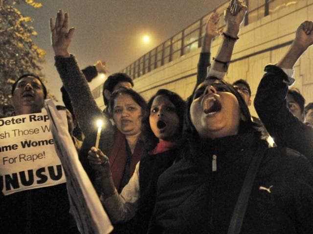 JNU students take part in a candle-light vigil to commemorate the December 16 gang-rape at the spot in Munirka, New Delhi, from where she had boarded bus in which she was brutally gang-raped. (HT Photo/Sunil Saxena)