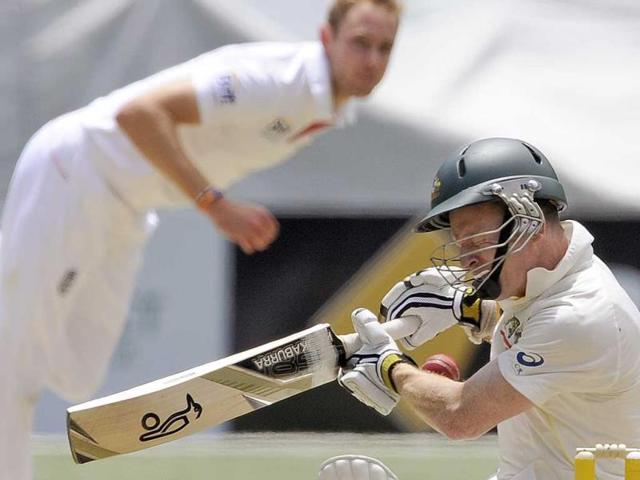 Australia's Chris Rogers (R) is struck on the head off the bowling of England's Stuart Broad (L) during the fourth Ashes Test at the Melbourne Cricket Ground in Melbourne, Australia. (AP Photo)