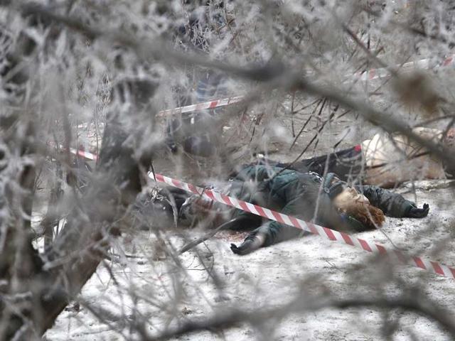 Victims' bodies lie outside a wreckage of a trolleybus in Volgograd, Russia. (AP Photo)
