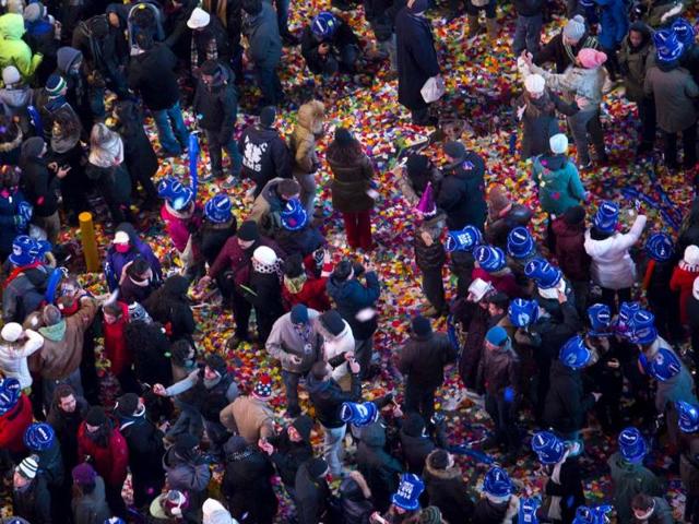 Confetti fills the streets in New York's Times Square as the new year is celebrated. (AP Photo)