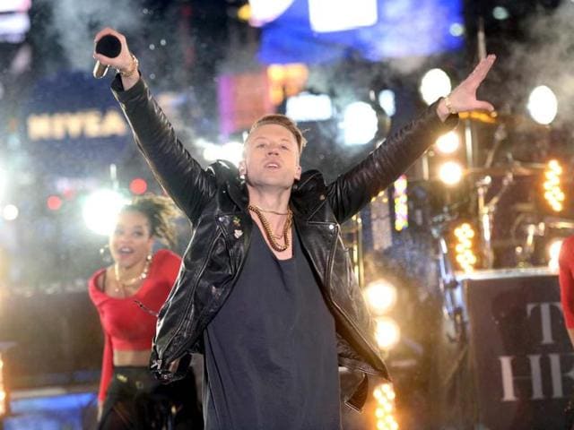 Artist-Macklemore-peforms-as-thousands-of-revelers-gather-in-New-York-s-Times-Square-to-celebrate-the-ball-drop-at-the-annual-New-Years-Eve-celebration-AFP-Photo Artist-Macklemore-peforms-as-thousands-of-revelers-gather-in-New-York-s-Times-Square-to-celebrate-the-ball-drop-at-the-annual-New-Years-Eve-celebration-AFP-Photo