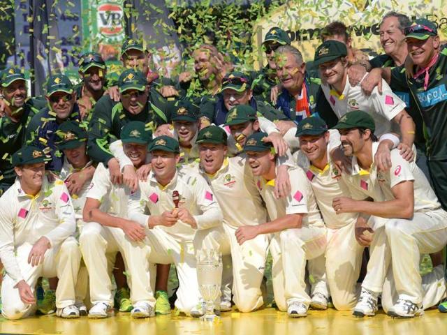 The Australian team celebrates their Ashes cricket clean sweep after defeating England on the third day of the fifth Ashes cricket Test at the Sydney Cricket Ground. (AFP Photo)