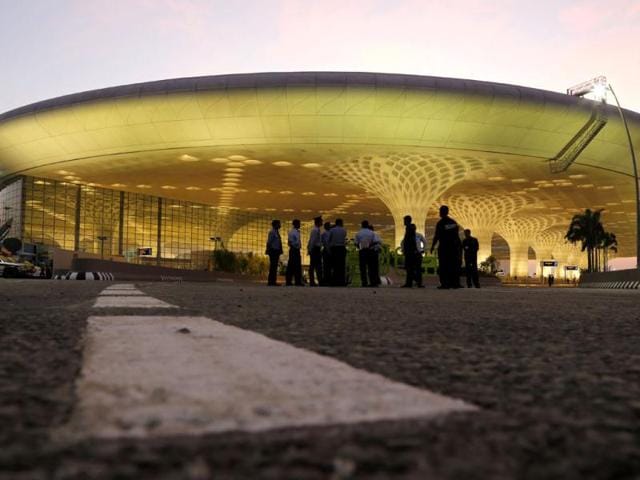 Indian security personnel stand outside T2, the new integrated terminal at Chhatrapati Shivaji International Airport, during its inauguration. AP