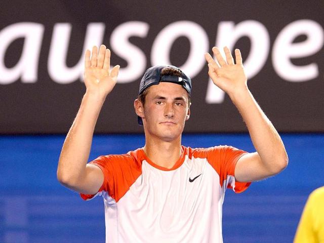 Australia-s-Bernard-Tomic-waves-to-the-crowd-after-retirement-in-his-men-s-singles-match-against-Spain-s-Rafael-Nadal-on-day-two-of-the-2014-Australian-Open-in-Melbourne-AFP-Photo