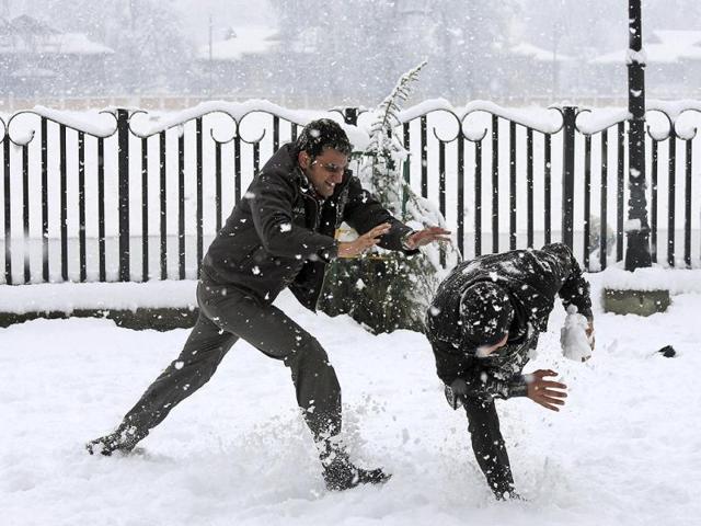 People play in the snow in Srinagar. Snowfall in Kashmir has disrupted power supply, air traffic and road traffic between Srinagar and Jammu. (AP Photo)