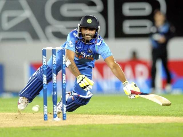 Ravindra Jadeja dives to make his ground against New Zealand during the third ODI at the Eden Park in Auckland. (AP Photo)