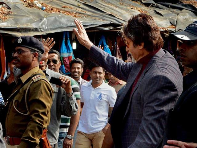 Amitabh Bachchan waves during a shoot in Ahmedabad Law Garden on Sunday. (PTI Photo)