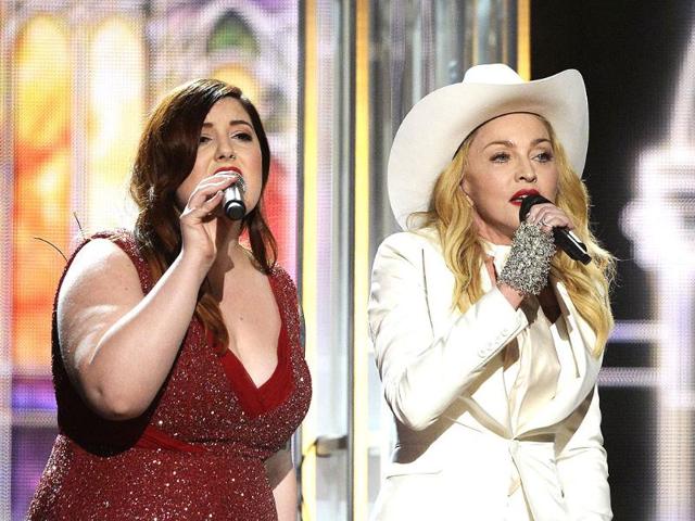 Singers Mary Lambert (l) and Madonna perform onstage.