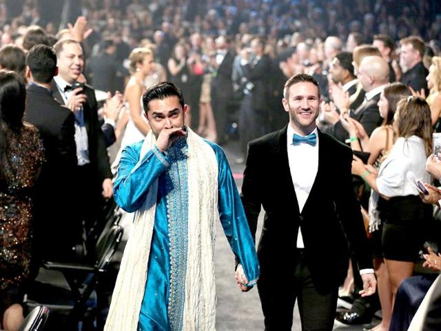 Audience members participate in a same sex wedding during a performance of Same Love by Macklemore and Ryan Lewis.