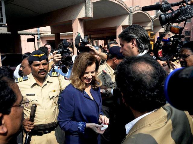 Valerie Trierweiler, surrounded by media and security personnel after visiting the Nutrition Rehabilitation and Research Centre at a hospital in the Dharavi area of Mumbai. (AFP) Valerie Trierweiler, surrounded by media and security personnel after visiting the Nutrition Rehabilitation and Research Centre at a hospital in the Dharavi area of Mumbai. (AFP)