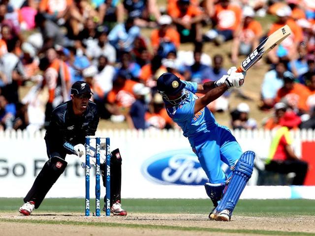 Ambati Rayudu (R) bats as New Zealand's Luke Ronchi fields during their fourth ODI at Seddon Park in Hamilton. (AFP Photo)