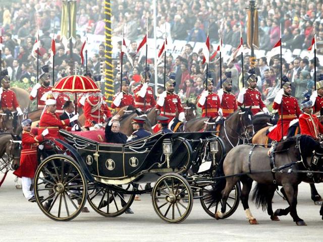 President Pranab Mukherjee waves as he arrives in a ceremonial buggy for the 'Beating the Retreat' ceremony in New Delhi on Wednesday. The ceremony marks the official end of the Republic Day celebrations. Ajay Aggarwal/HT Photo