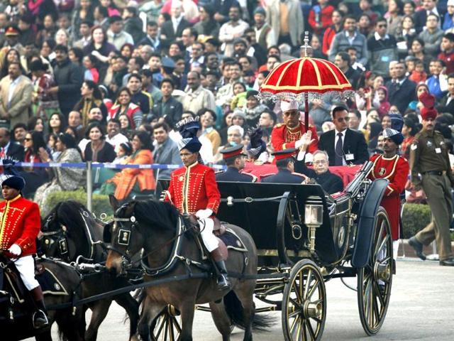 President Pranab Mukherjee waves as he arrives in a ceremonial buggy for the 'Beating the Retreat' ceremony in New Delhi on Wednesday. The ceremony marks the official end of the Republic Day celebrations. Ajay Aggarwal/HT Photo