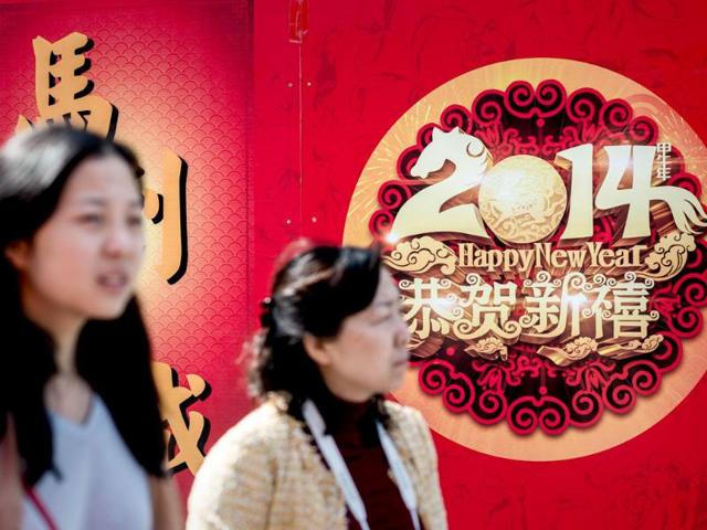 Two women walk past decorations in Hong Kong on the eve of the Lunar New Year. Over a billion Chinese in China and millions more all over the world will be celebrating the Lunar New Year.(AFP photo) Two women walk past decorations in Hong Kong on the eve of the Lunar New Year. Over a billion Chinese in China and millions more all over the world will be celebrating the Lunar New Year.(AFP photo)