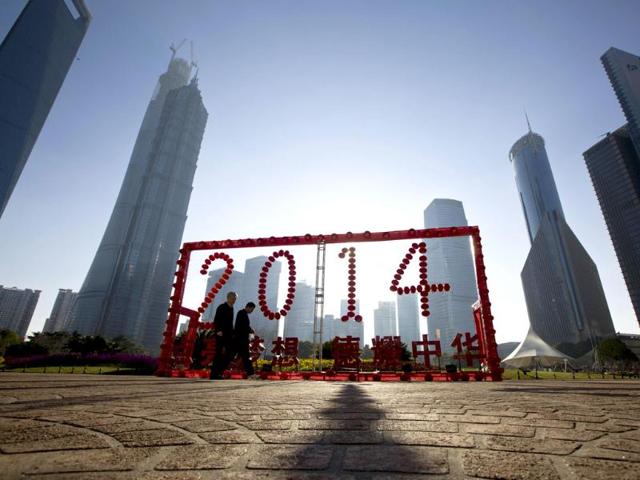 People walk past a 2014 installation at Lujiazui financial district of Pudong ahead of the Chinese lunar New Year in Shanghai. (Reuters photo) People walk past a 2014 installation at Lujiazui financial district of Pudong ahead of the Chinese lunar New Year in Shanghai. (Reuters photo)