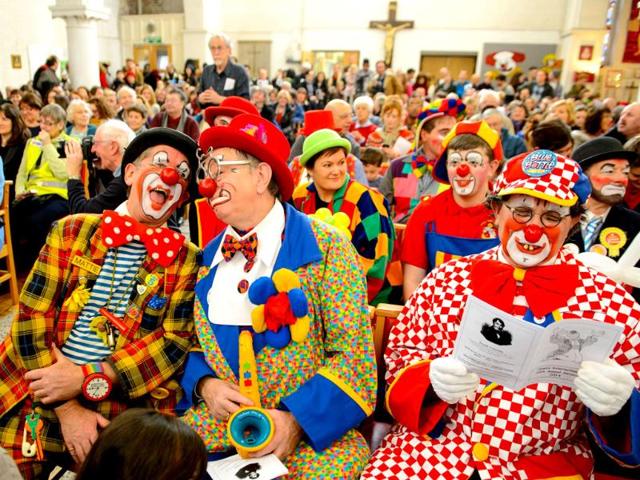 Clowns attend the annual service in memory of celebrated clown Joseph Grimaldi, at the Holy Trinity Church, in London. (AP photo)