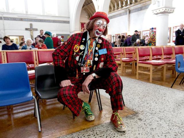A clown sits before a church service in memory of Joseph Grimaldi at Holy Trinity Church in Dalston, east London. (Reuters photo)