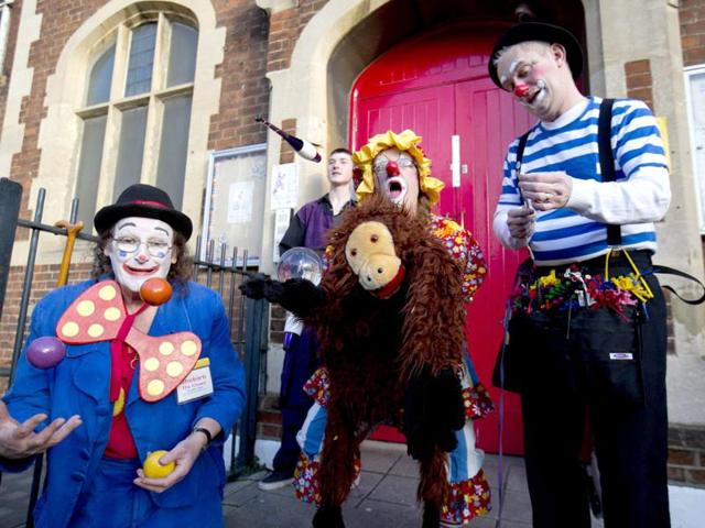 Clowns perform before a church service in memory of Joseph Grimaldi at Holy Trinity Church in Dalston, east London. (Reuters photo)