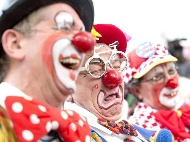 Clowns react during a church service in memory of Joseph Grimaldi at Holy Trinity Church in Dalston, east London. (Reuters photo)