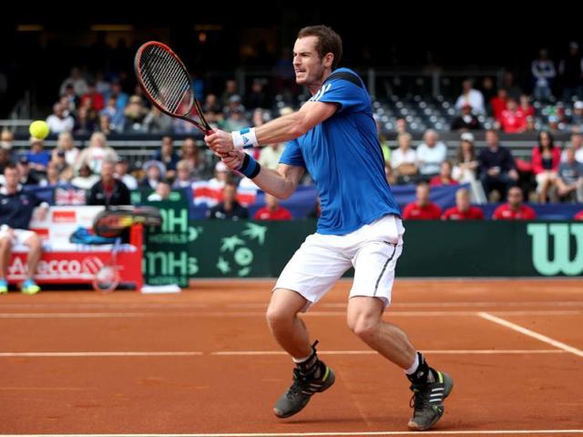 Andy Murray of Great Britain plays a backhand volley against Sam Querrey of the United States during the Davis Cup World Group first round in San Diego. (AFP Photo)
