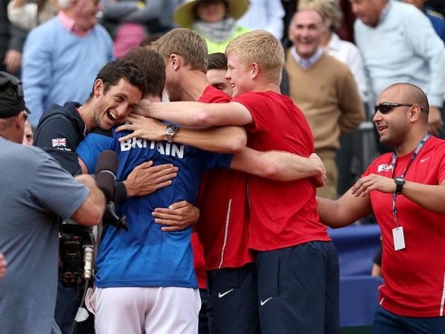 Andy Murray of Great Britain is hugged by team mate James Ward after his four set victory against Sam Querrey of the United States during day three of the Davis Cup World Group in San Diego. (AFP Photo)