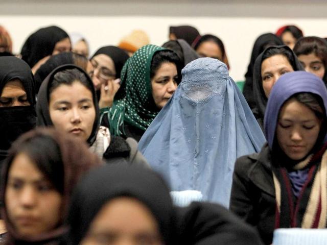 Afghan presidential candidate Zalmai Rassoul's supporters listen to his speech during the presidential candidates campaign in Kabul. (Reuters)