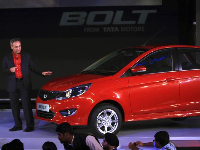 Tata Motors' passenger vehicles president Ranjit Yadav introduces a premium hatchback, Bolt, in New Delhi. The Indian automaker unveiled two new cars, the sedan Zest and Bolt. (AP Photo/Tsering Topgyal)