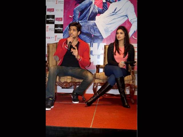Siddharth makes a point, as Parineeti looks on.