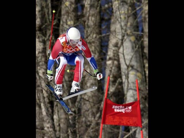 France's David Poisson jumps during men's downhill training at the Sochi 2014 Winter Olympics in Russia. (AP photo) 