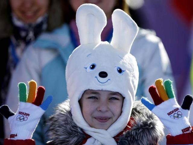 A girl wears a hat in the shape of the Sochi Winter Olympics mascot while watching the men's snowboard slopestyle qualifying at the Rosa Khutor Extreme Park ahead of the 2014 Winter Olympics in Krasnaya Polyana, Russia. (AP photo) 