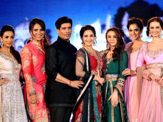 Bollywood actresses (L to R) Malaika Arora Khan, Lara Dutta, Madhuri Dixit Nene, Preity Zinta, Isha Koppikar and Evelyn Sharma pose as they display creations by designer Manish Malhotra. (PTI)