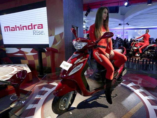 The companies employ both foreign and Indian models. A model sits on a Rodeo RZ scooter at the Mahindra and Mahindra pavilion during the 12th Auto Expo 2014 in Greater Noida, on the outskirts of New Delhi. (Reuters)