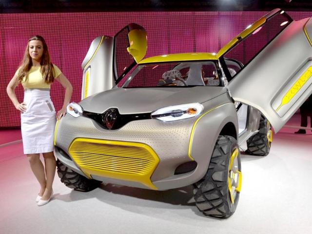 While the money is good, car and bike girls at Auto Expo fear 'harrowing crowds' and misbehaviour. A model stands alongside the Renault concept KWLD motor-car at the 12th Indian Auto Expo 2014 in Greater Noida, on the outskirts of New Delhi. (AFP Photo)