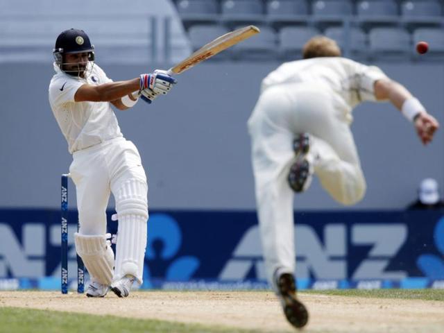 Virat Kohli (L) hits a four off New Zealand's Neil Wagner (R) during the second innings on day four of the first Test at Eden Park in Auckland. (Reuters Photo)