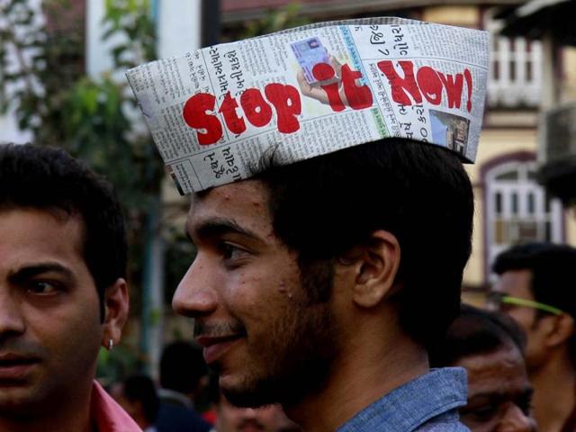 A visitor makes a statement at the final day of the Kala Ghoda Art Festival in Mumbai. (HT Photo/ Satish Bate)
