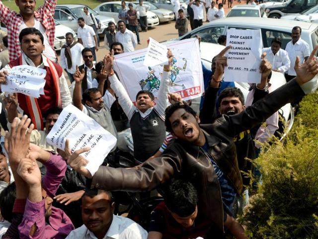 Demonstrators demanding a separate state of Telangana shout slogans outside Parliament in New Delhi. (AFP Photo)