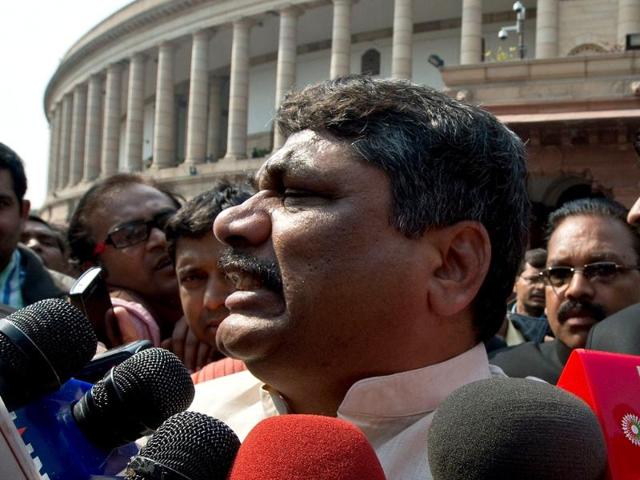 Telugu Desam Party (TDP) MP Venugopal Reddy talks (C) to the media following scuffles inside the building disrupted Parliament. (AFP Photo)