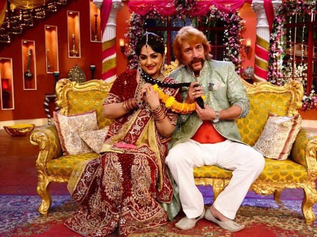 Upasana Singh and Razzak Khan play along uring their 'marriage' on Comedy Nights with Kapil. Upasana Singh and Razzak Khan play along uring their 'marriage' on Comedy Nights with Kapil.