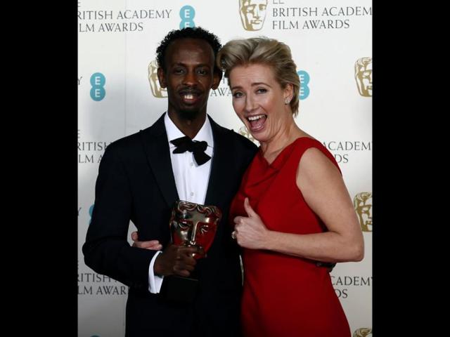 Barkhad Abdi celebrates winning Best Supporting Actor for Captain Phillips with Emma Thompson at the British Academy of Film and Arts (BAFTA) awards ceremony at the Royal Opera House in London on February 16, 2014. (Reuters Photo)